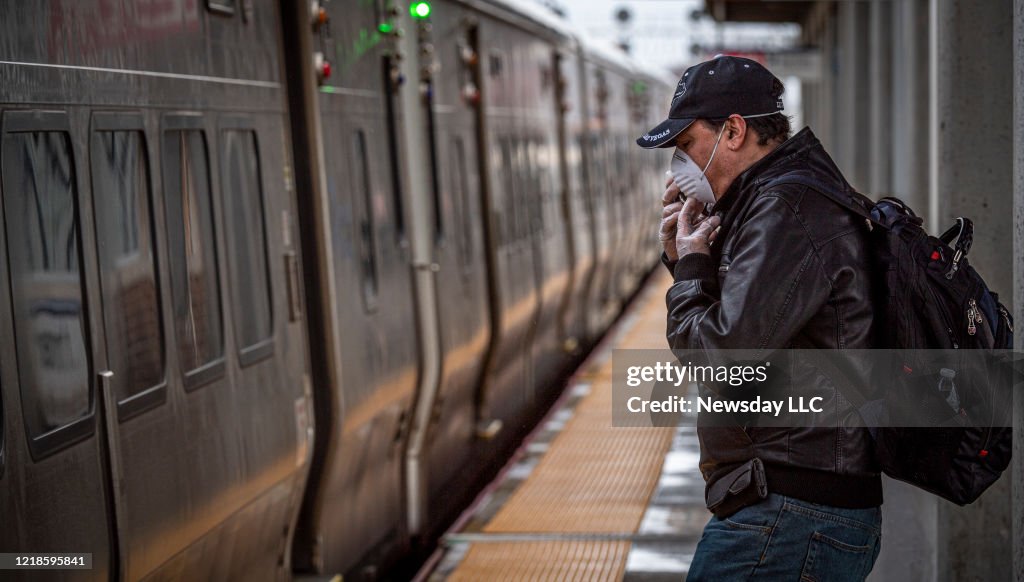 Commuter wears face mask while waiting for train on Long Island during pandemic