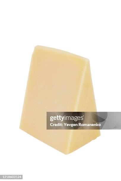 triangle chunk of parmesan cheese isolated on white background - hartkäse stock-fotos und bilder