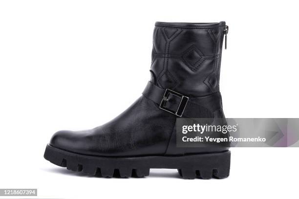 black leather boot isolated on white background - black boot fotografías e imágenes de stock