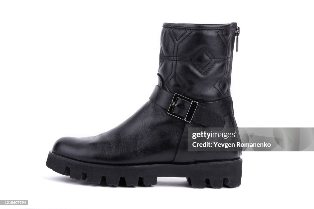 Black leather boot isolated on white background