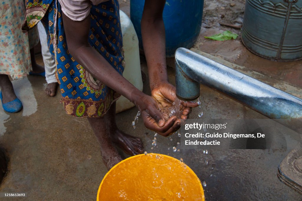 A girl washing her hands at a borehole in southern Malawi.