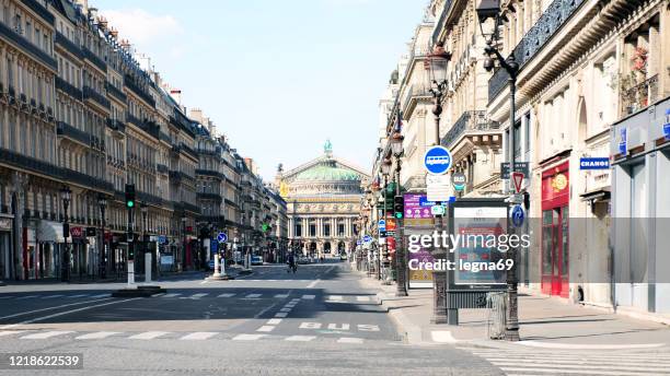 garnier opera with empty streets during pandemic covid 19 in europe. - avenue de l'opera stock pictures, royalty-free photos & images