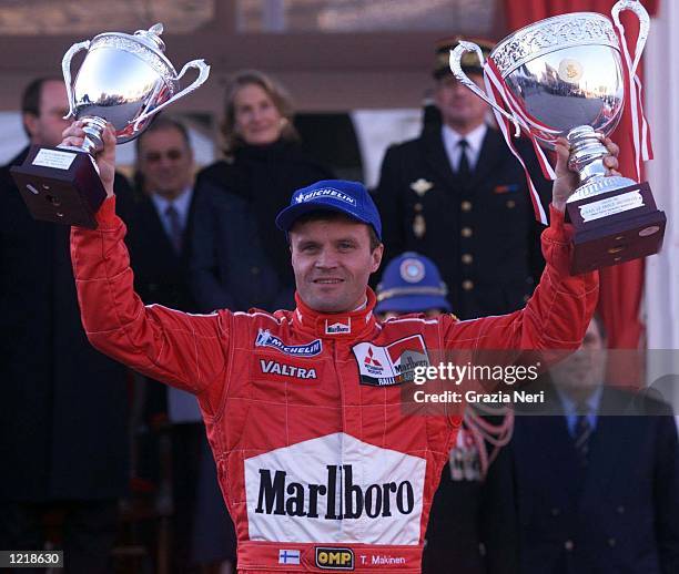 Tommi Makinen with Mitsubishi Lancer Evo VI celebrates victory during the World Rally Championships in Monte Carlo, Monaco. Germano Gritti / Grazia...