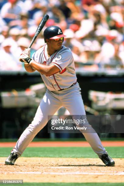 Andruw Jones of the Atlanta Braves bats during an MLB game at Veterans Stadium in Philadelphia, Pennsylvania. Jones played for 17 seasons with 5...