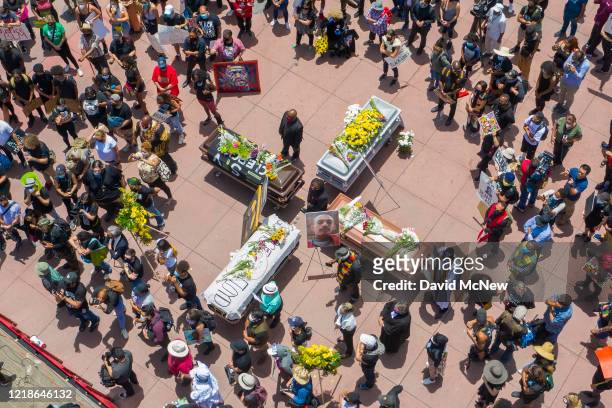 Drone aerial view shows a memorial service for George Floyd and other victims of police killings on a downtown street as demonstrations continue over...