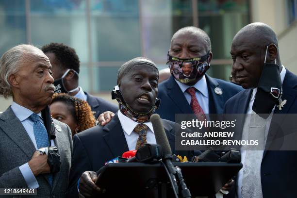 Marcus Arbery , Ahmaud Arbery's father, speaks alongside Reverend Al Sharpton , Floyd family attorney Ben Crump , and members of the Floyd family...