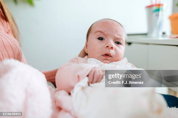 portrait of baby looking at camera - funny face baby stock pictures, royalty-free photos & images