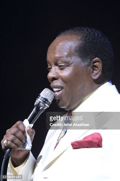 Singer Lou Rawls is shown performing on stage during a "live" concert appearance on September 15, 2002.