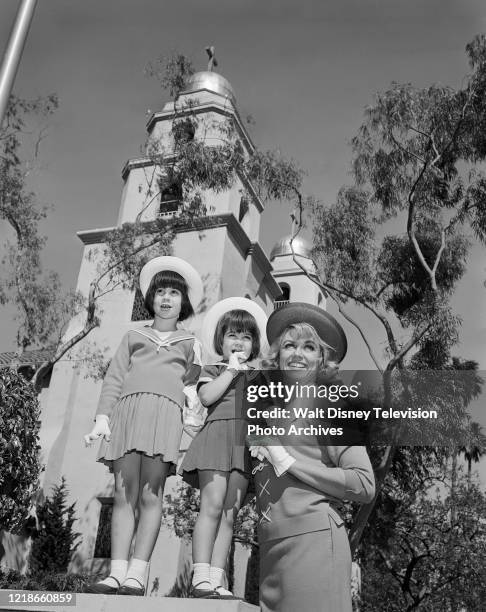 Dorothy Malone and her daughters dressed up and going to church on Sunday, behind the scenes during the making of the ABC tv series 'Peyton Place'.