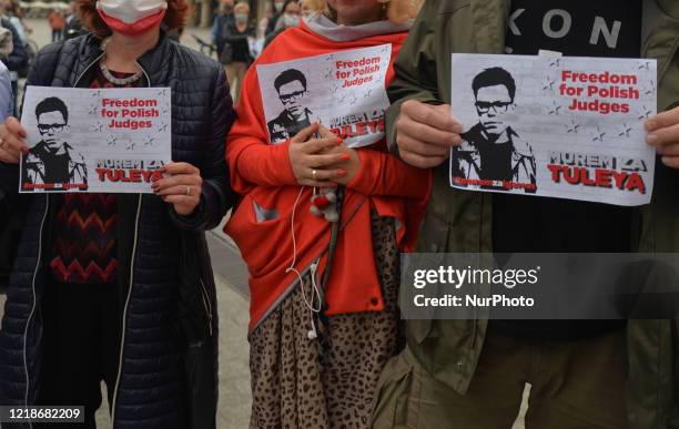 Members of the Committee for the Defence of Democracy hold 'Freedom for Polish Judges' signs, during the 'Support for Judge Igor Tuley' protest...