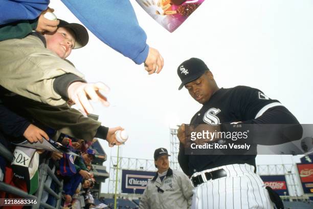 Frank Thomas of the Chicago White Sox signs autographs before an MLB game at Comiskey Park in Chicago, Illinois. Thomas played for 19 seasons with 3...