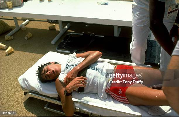 Gabriella Anderson Schiess of Sweden is placed on a stretcher during the Marathon event at the 1984 Olympic Games at the Colliseum Stadium in Los...