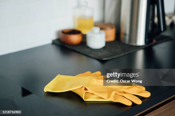 plastic gloves on the kitchen worktop - handschuhe stock-fotos und bilder