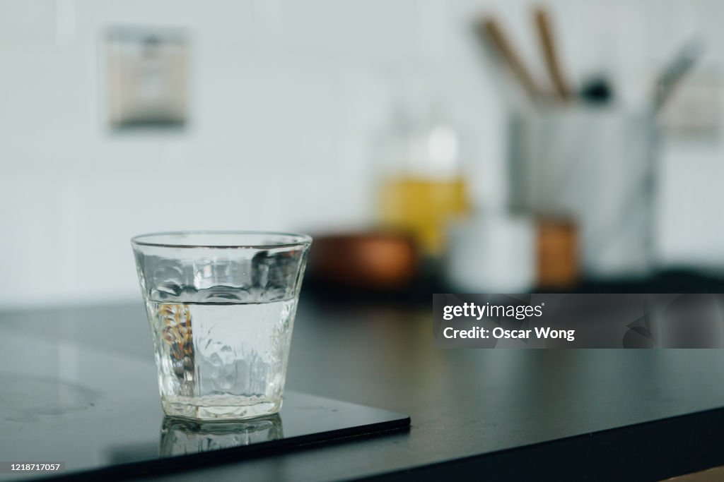 A Glass Of Water On The Kitchen Worktop