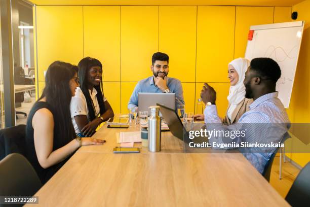 ethnic business people working together in the office. - office small business stock-fotos und bilder