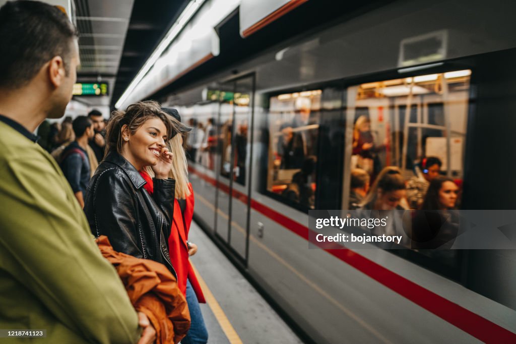Friends on train station