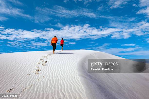 young hikers are walking in the white desert, new mexico,usa - white sand dune stock pictures, royalty-free photos & images