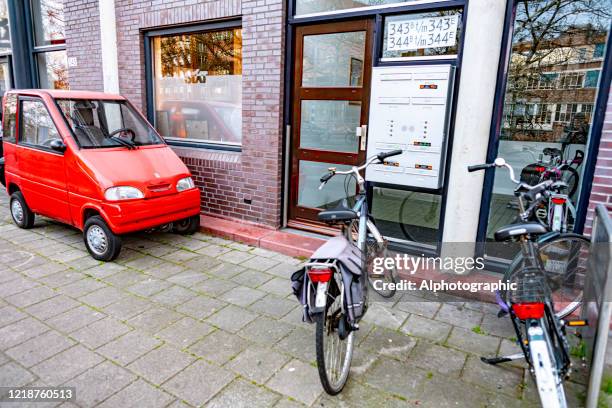 miniature electric vehicle on an amsterdam street. - ballpoint pen stock pictures, royalty-free photos & images