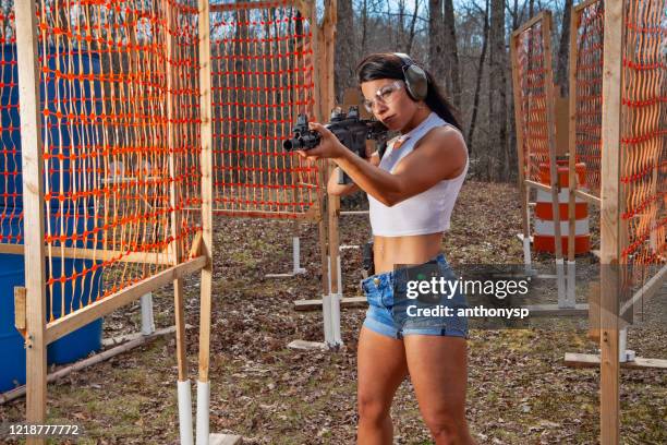woman aiming pistol - ar 15 stock pictures, royalty-free photos & images