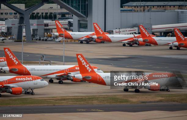 Temporarily out of use EasyJet aircraft at Gatwick Airport on June 9, 2020 in London, England. Gatwick Airport has introduced a range of protective...
