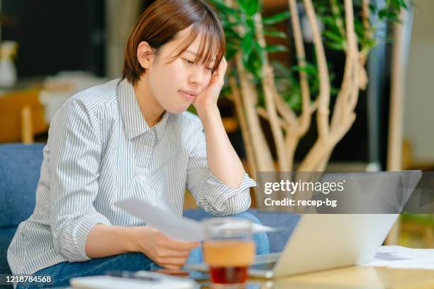 woman feeling stressed because of unemployment - unemployment benefits stock pictures, royalty-free photos & images