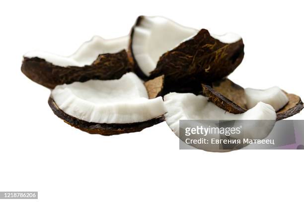 pieces of broken coconut isolated on white background. close up. selective focus. copy space - coconut chunks stock pictures, royalty-free photos & images