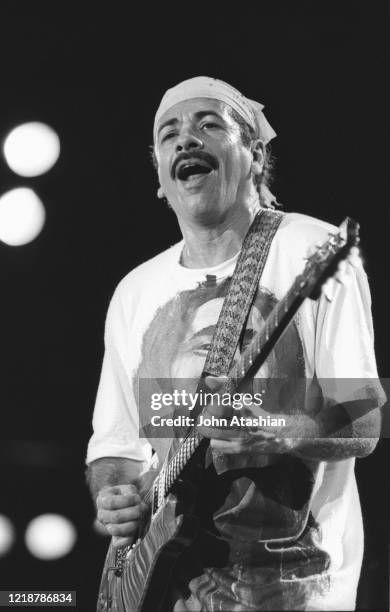 Singer, songwriter and guitarist Carlos Santana is shown performing on stage during a concert appearance on January 19, 1991.