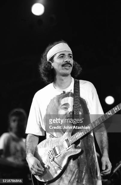 Singer, songwriter and guitarist Carlos Santana is shown performing on stage during a concert appearance on January 19, 1991.