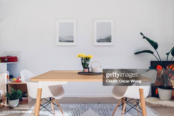 a modern dining room - wood dining table stock pictures, royalty-free photos & images