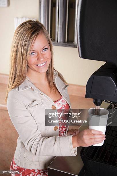 teenager at soda fountain in fast food restaurant - soda fountain stock pictures, royalty-free photos & images