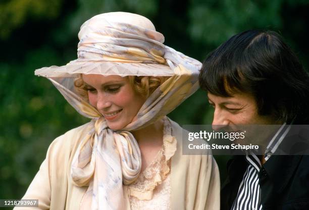 View of American actress Mia Farrow, in costume for her role in 'The Great Gatsby' , and her husband, German-born American musician and composer...