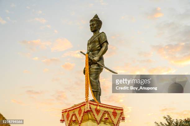 king mangrai monument in the downtown of chiang rai city of thailand. - king of thailand stock-fotos und bilder