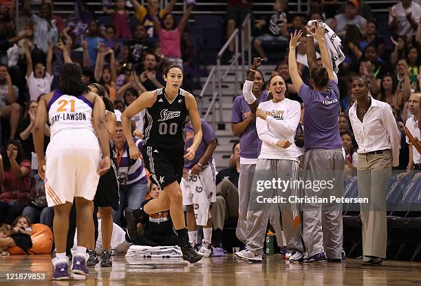 Ruth Riley of the San Antonio Silver Stars reacts as Diana Taurasi of the Phoenix Mercury celebrates on the bench during the WNBA game at US Airways...