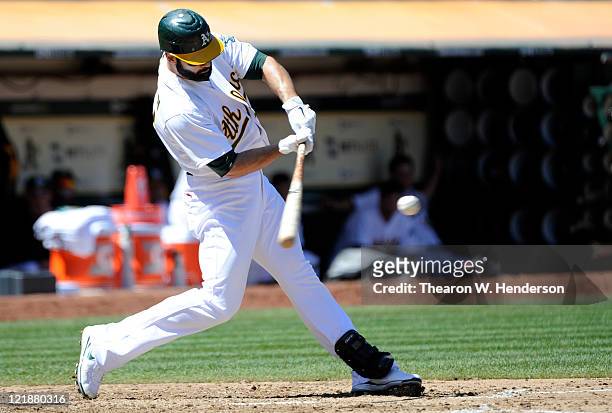 Conor Jackson of the Oakland Athletics bats against the Toronto Blue Jays during an MLB baseball game August 21, 2011 at the O.co Coliseum in...