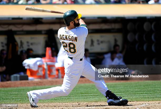 Conor Jackson of the Oakland Athletics bats against the Toronto Blue Jays during an MLB baseball game August 21, 2011 at the O.co Coliseum in...