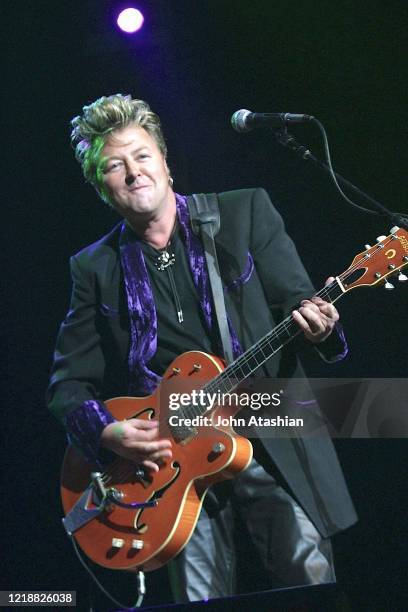 Singer, songwriter and guitarist Brian Setzer is shown performing on stage during a "live" concert appearance on July 8, 2002.