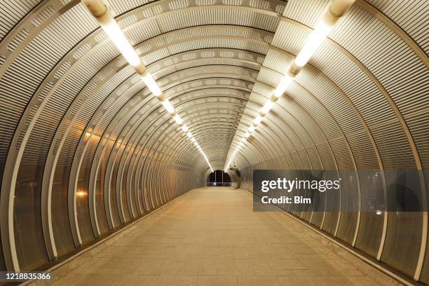 empty modern tunnel in london, covid-19 effect - empty catwalk stock pictures, royalty-free photos & images