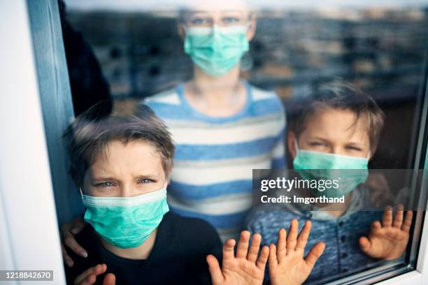 children staying at home during covig-19 pandemic - staying indoors stock pictures, royalty-free photos & images