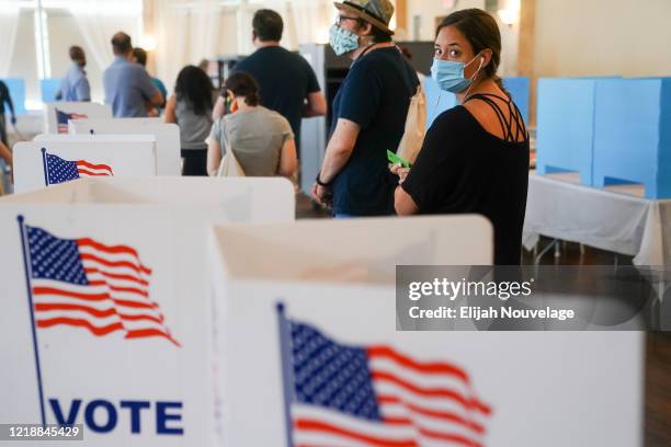 People wait in line to vote in Georgia's Primary Election on June 9, 2020 in Atlanta, Georgia. Voters in Georgia, West Virginia, South Carolina,...