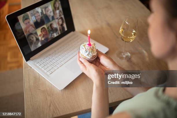 woman celebrating birthday alone at home - zoom birthday stock pictures, royalty-free photos & images