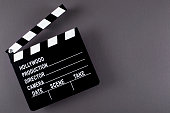 Movie clapper board on dark background with copy space.