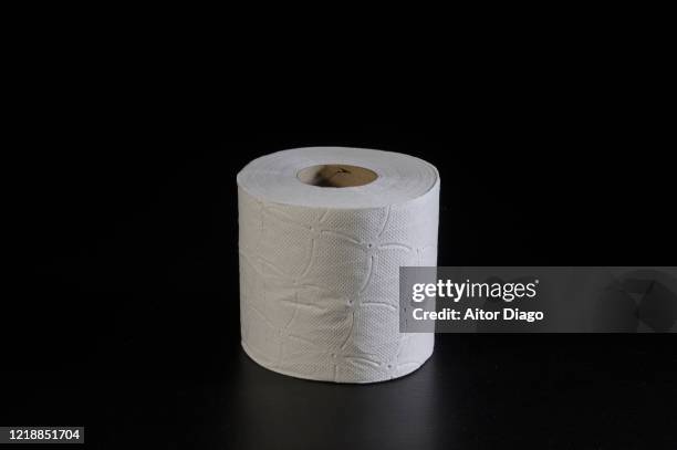 close up of a roll of hygienic paper on a table. - toilet paper stock pictures, royalty-free photos & images