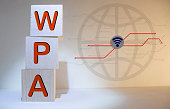 acronym wpa for Wi-Fi Protected Access concept represented by black and white letter tiles on a marble chessboard with chess pieces