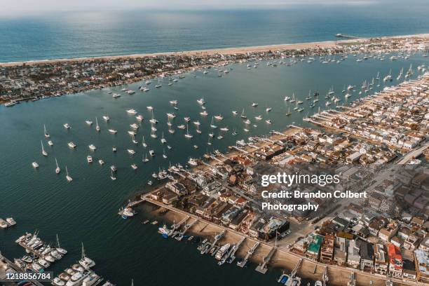 drone point of view of boats - newport beach stock-fotos und bilder