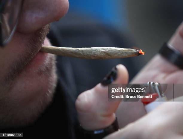 Recreational marijuana smoker indulges in smoking weed on April 14, 2020 in the Bushwick section of the Brooklyn borough of New York City. As some...