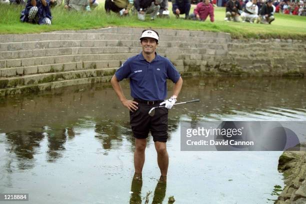 Jean Van de Velde of France still smiling despite finding the Barry Burn with his third shot on the final hole of the British Open at Carnoustie in...