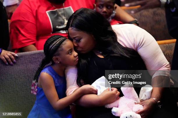 Roxie Washington and Gianna Floyd, daughter of George Floyd, attend the funeral service in the chapel at the Fountain of Praise church June 9, 2020...