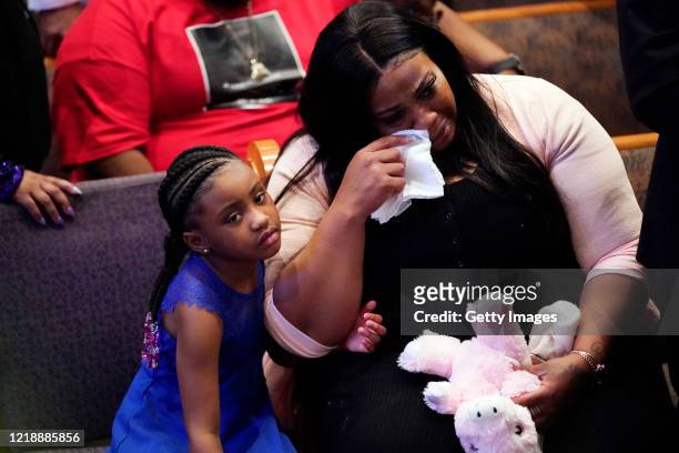 Roxie Washington and Gianna Floyd, daughter of George Floyd, attend the funeral service in the chapel at the Fountain of Praise church June 9, 2020...