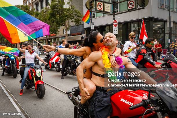 Amy Dabner embraces Adam Schindler at the start of the annual Gay Pride Parade in San Francisco, California, on Sunday, June 30, 2019. Parade and...