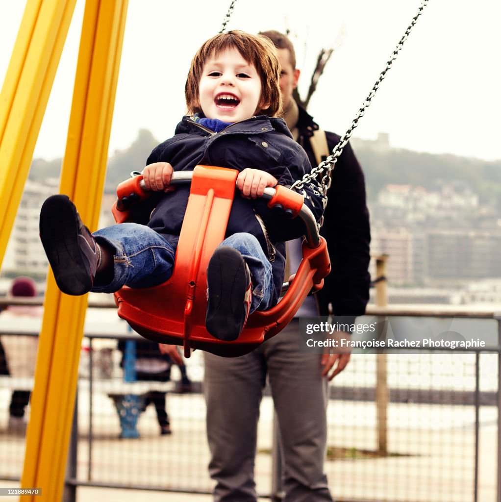 Happy child on swing